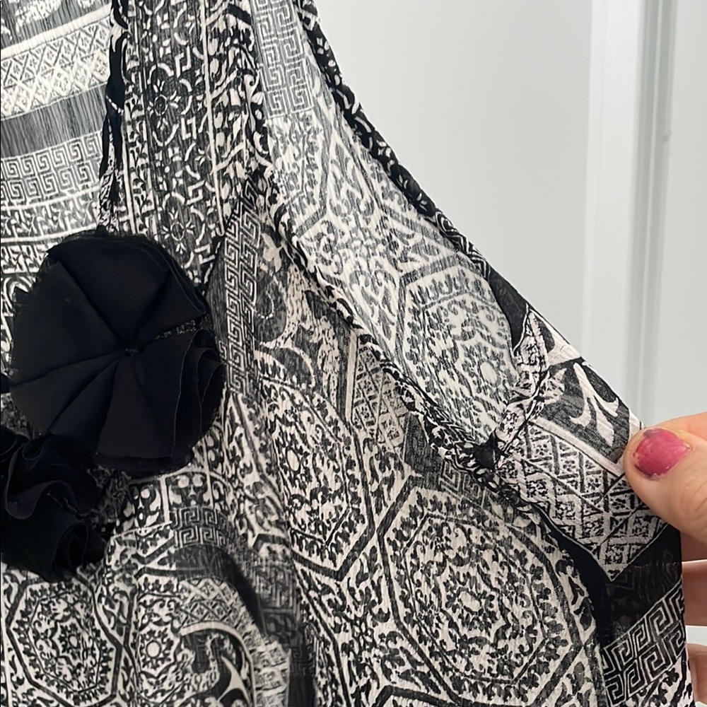 Black and White Patterned top with Floral Detail, new no tag.
